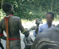 A tourist films Jarawa on the Andaman Trunk Road.© Survival