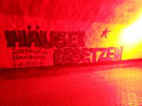 Grafitto "Häuser besetzen in Dortmund, Hamburg und Leipzig"