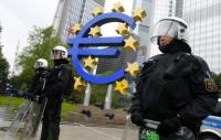 Riot Police Stand Near Euro Sign in Front of European Central Bank