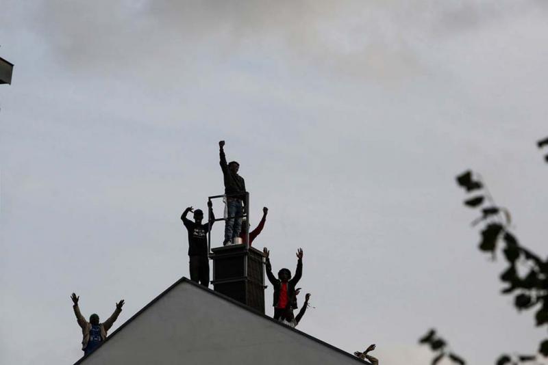 Refugees auf dem Dach  (Foto: pm_cheung)