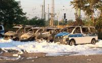The gutted cop cars. Photo: DPA