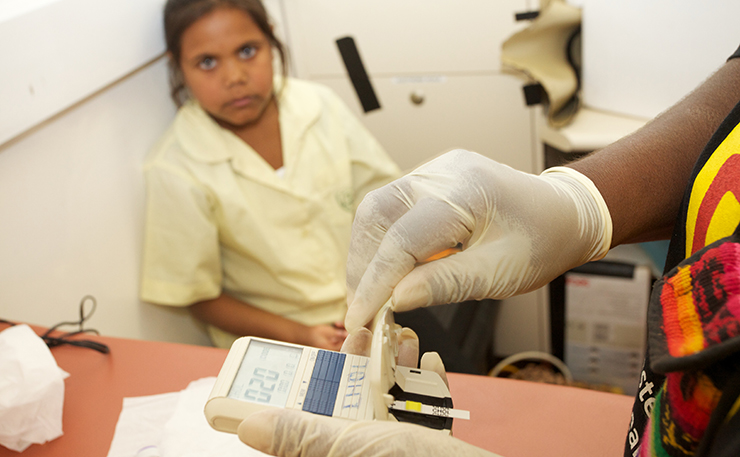 A young girl is tested by Annette Stokes, Co-Chief Investigator of the Western desert Kidney Project. (IMAGE: Matt Scurfield)