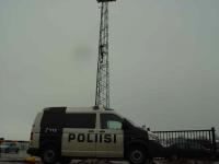 Next to Police in front of the Congress Center Activists climbed on a tower.