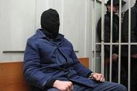 Tichonov mit Maske nach der Festnahme