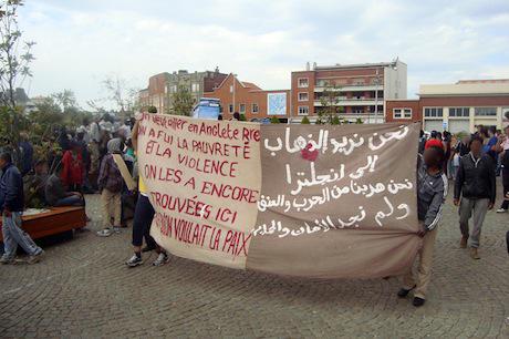 Migrant protest in Calais: "We want to go to England - we fled war and violence and found no safety and peace." Image courtesy of Calais Migrant Solidarity.