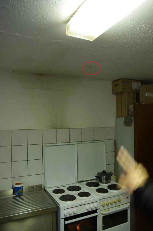 The red circle is a hole, where water pours through from the shower room above