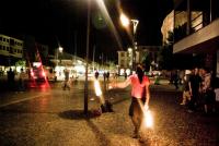 Fire juggler at night demo in Mainz, Germany.